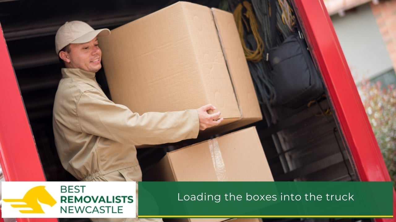 Loading the boxes into the truck Loading the boxes into the truck